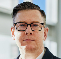 CEO Alexander Hughes, executive heading a crypto trading company, portrait